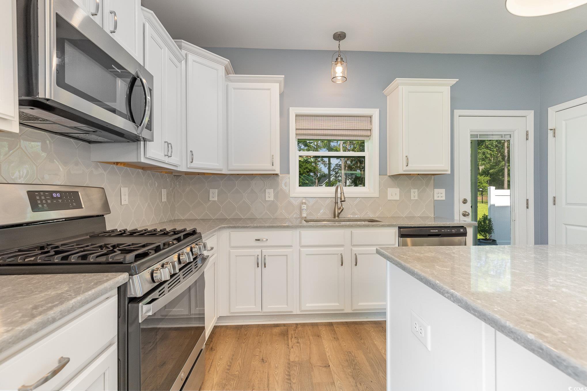 1438 Perch Place Longs, SC 29568 - Photo 10 of 39 Kitchen with light hardwood / wood-style floors, a