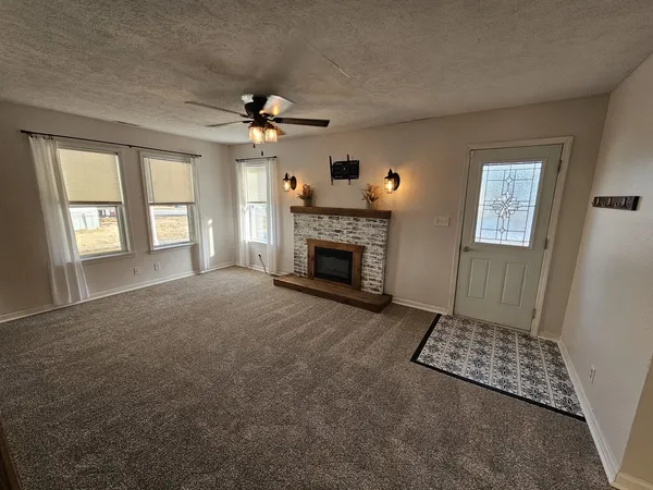 a living room with furniture and a fireplace