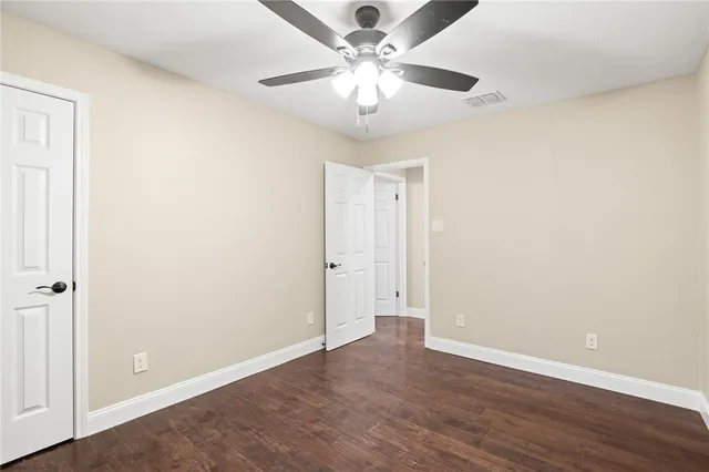 a view of an empty room with a fan