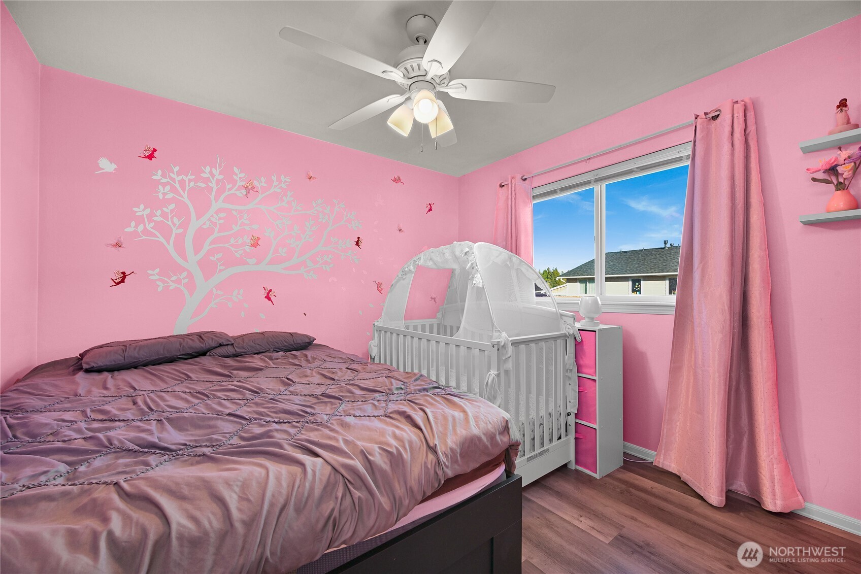 6196 Quail Court Ferndale, WA 98248 - Photo 18 of 27 a bedroom with a bed and a chandelier