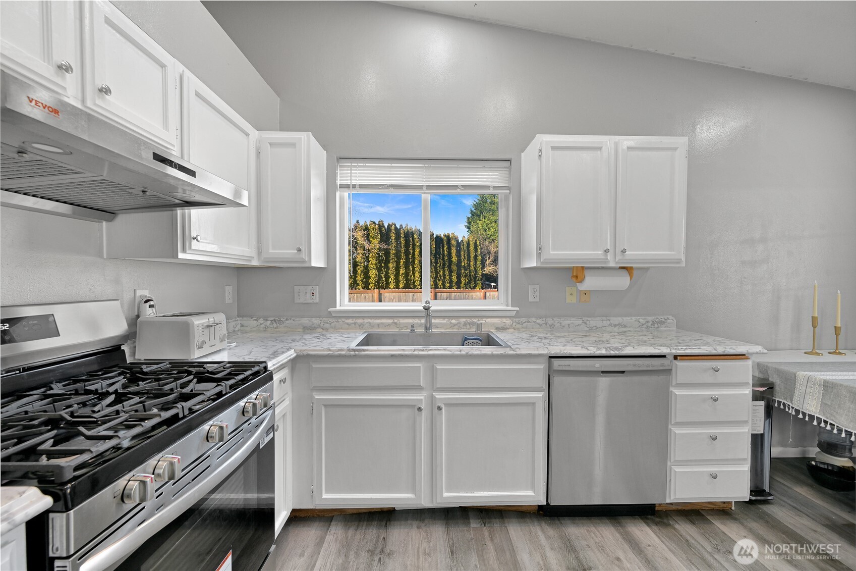 6196 Quail Court Ferndale, WA 98248 - Photo 8 of 27 a kitchen with cabinets appliances and a window