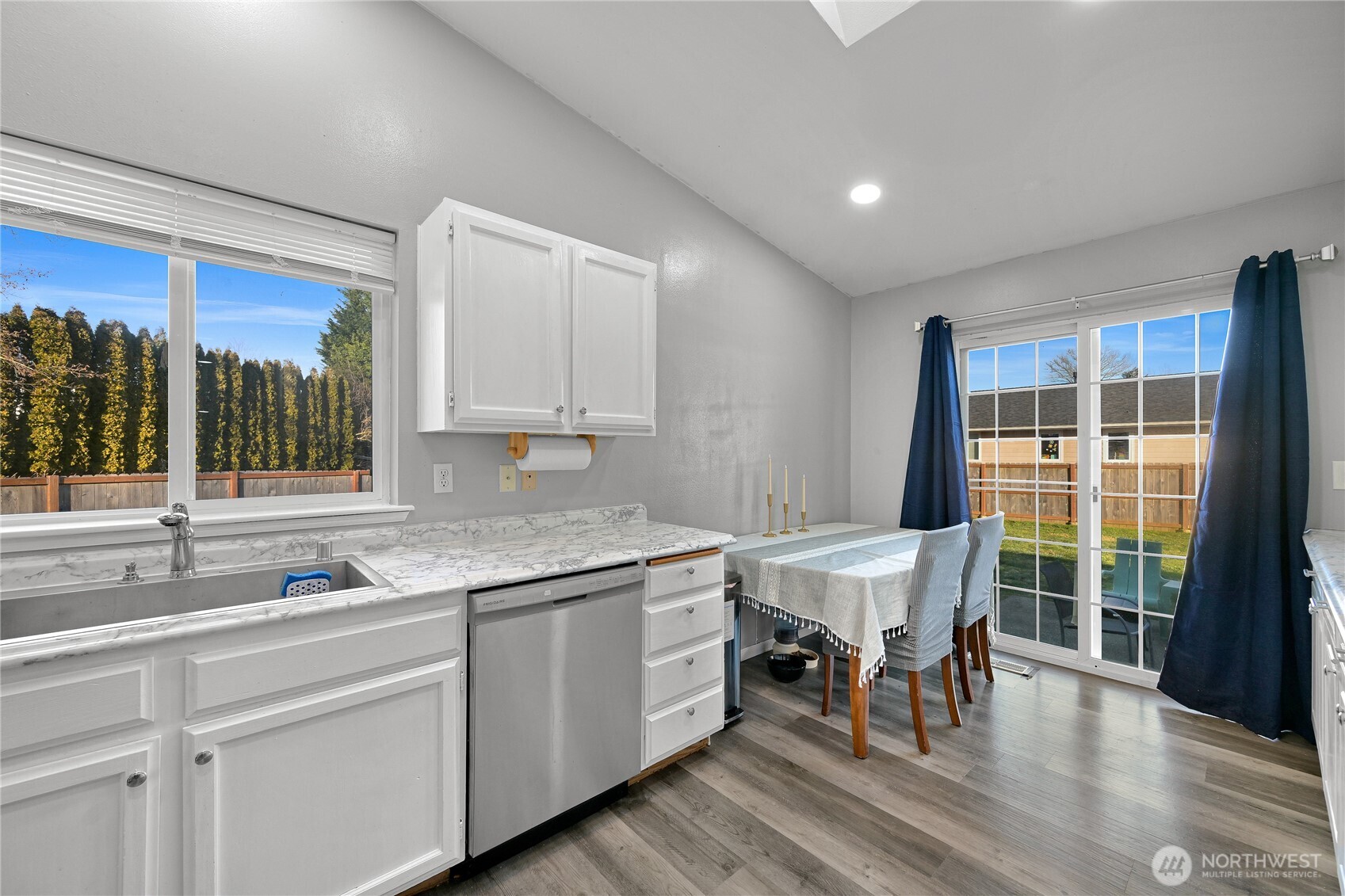 6196 Quail Court Ferndale, WA 98248 - Photo 9 of 27 a kitchen with a sink and chairs
