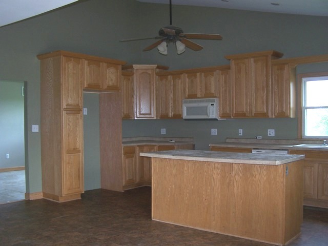 1120 North 32nd Road Ottawa, IL 61350 - Photo 5 of 23 a kitchen with granite countertop a sink stainless steel appliances cabinets and a window