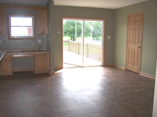 1120 North 32nd Road Ottawa, IL 61350 - Photo 8 of 23 a view of an empty room with a window