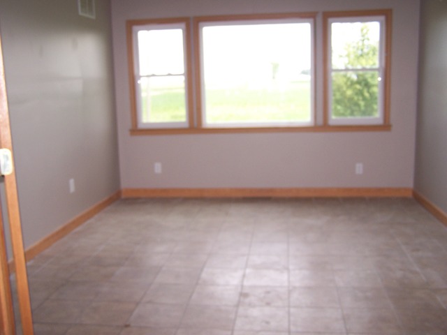 1120 North 32nd Road Ottawa, IL 61350 - Photo 9 of 23 an empty room with a window