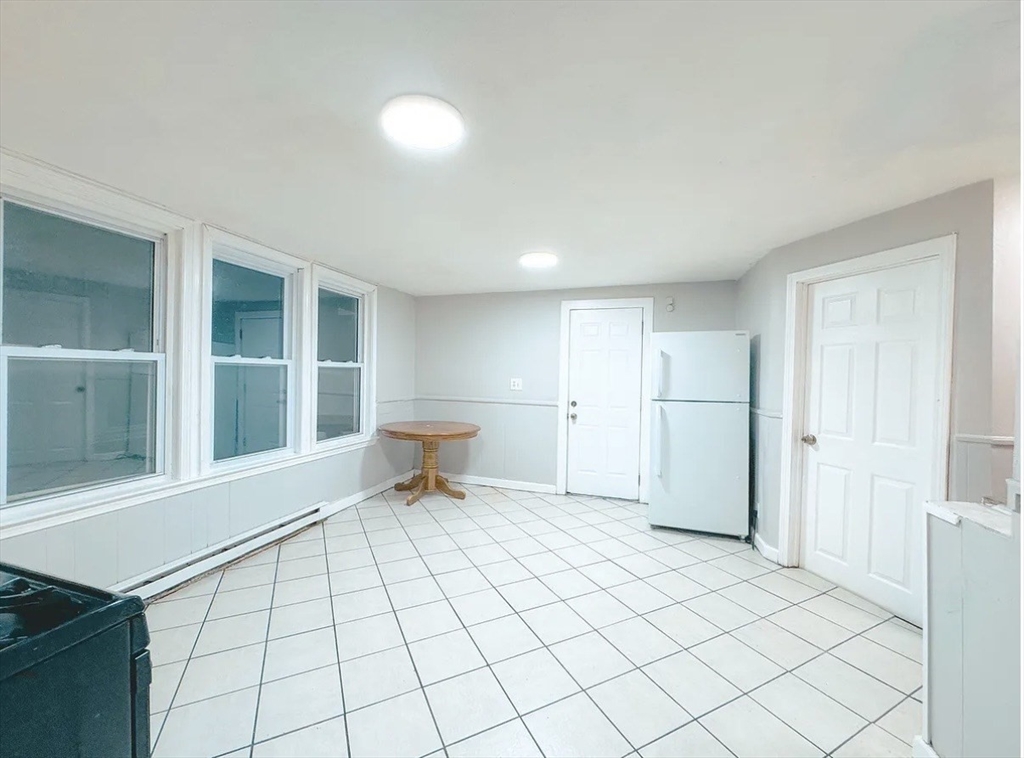 37 Maverick Street Chelsea, MA 02150 - Photo 20 of 25 a view of a room with a lounge chair and windows