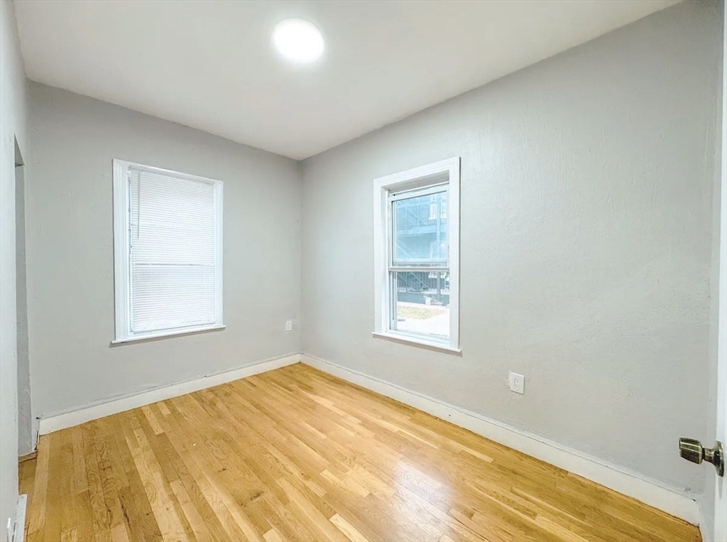 37 Maverick Street Chelsea, MA 02150 - Photo 25 of 25 a view of an empty room with a window