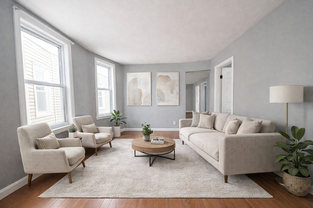 37 Maverick Street Chelsea, MA 02150 - Photo 3 of 25 a living room with furniture and a large window
