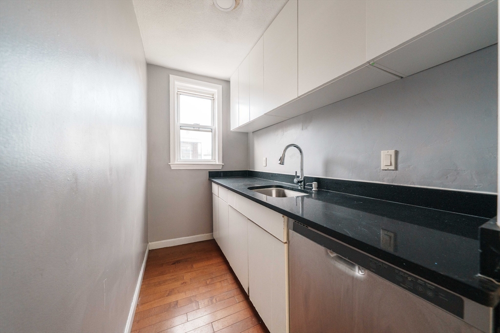 37 Maverick Street Chelsea, MA 02150 - Photo 9 of 25 a kitchen with a sink and a window