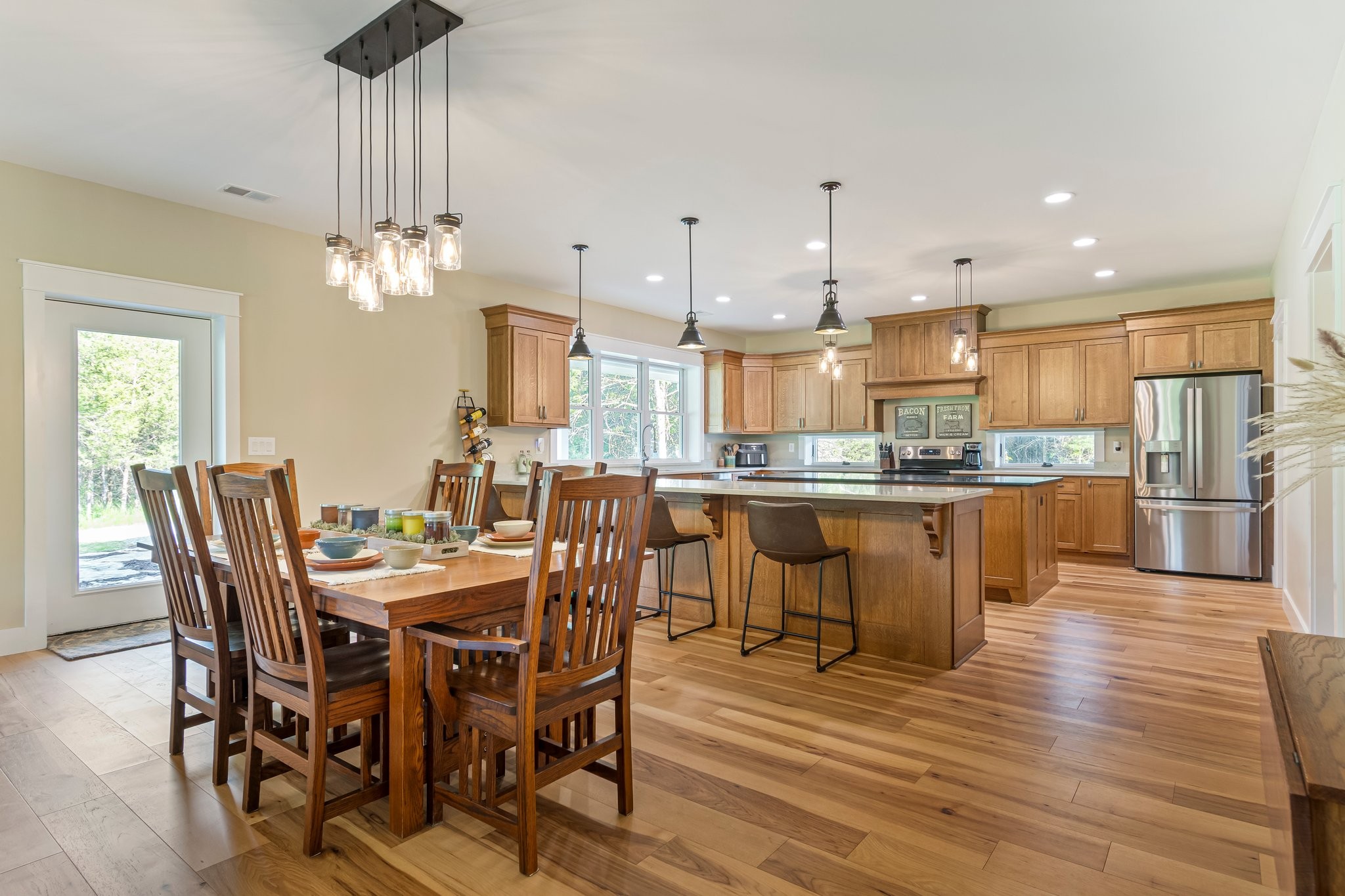 2825 Oregon Road Milton, TN 37118 - Photo 13 of 71 a view of a dining room and livingroom with furniture wooden floor a chandelier
