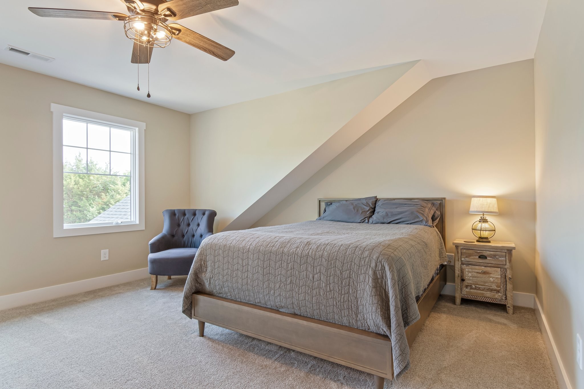 2825 Oregon Road Milton, TN 37118 - Photo 40 of 71 a bedroom with a bed and a chandelier