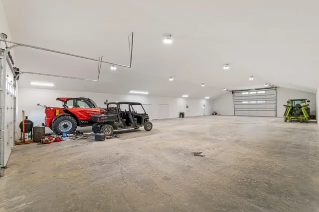 an aerial view of a house with a garden and swimming pool
