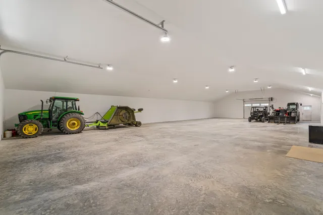 a view of a lush green hillside and houses
