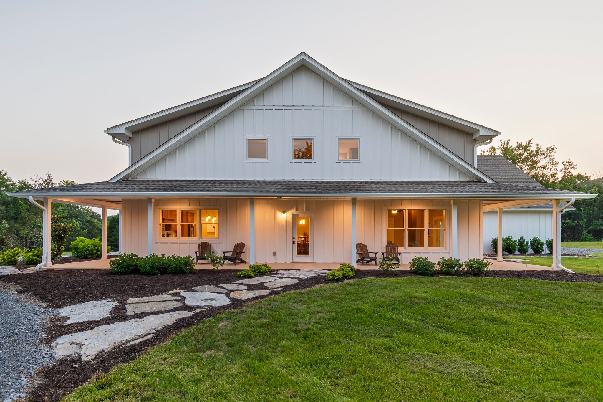 2825 Oregon Road Milton, TN 37118 - Photo 8 of 71 a front view of a house with a garden and trees