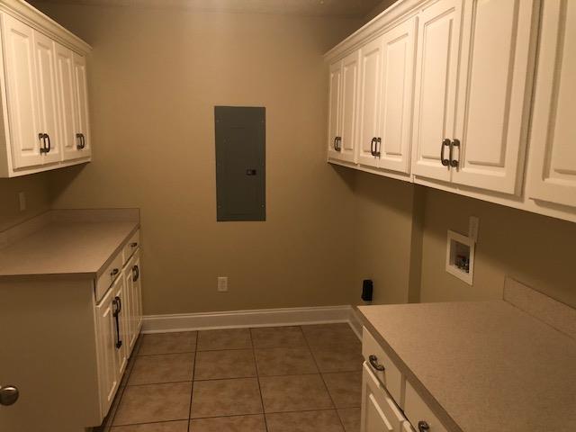 407 Quail Ridge Drive Midland, GA 31820 - Photo 14 of 28 oversized laundry with lots of cabinets and sink