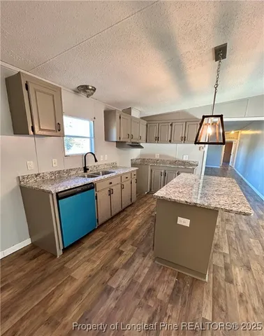 a living room with granite countertop furniture sink and a table