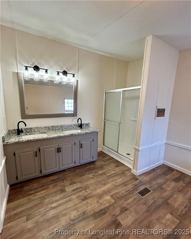193 Clarington Court Lumber Bridge, NC 28357 - Photo 18 of 25 a bathroom with a double vanity sink and mirror