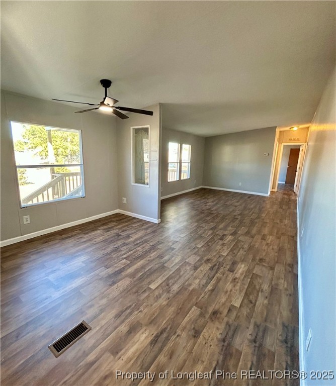 193 Clarington Court Lumber Bridge, NC 28357 - Photo 4 of 25 an empty room with wooden floor and windows