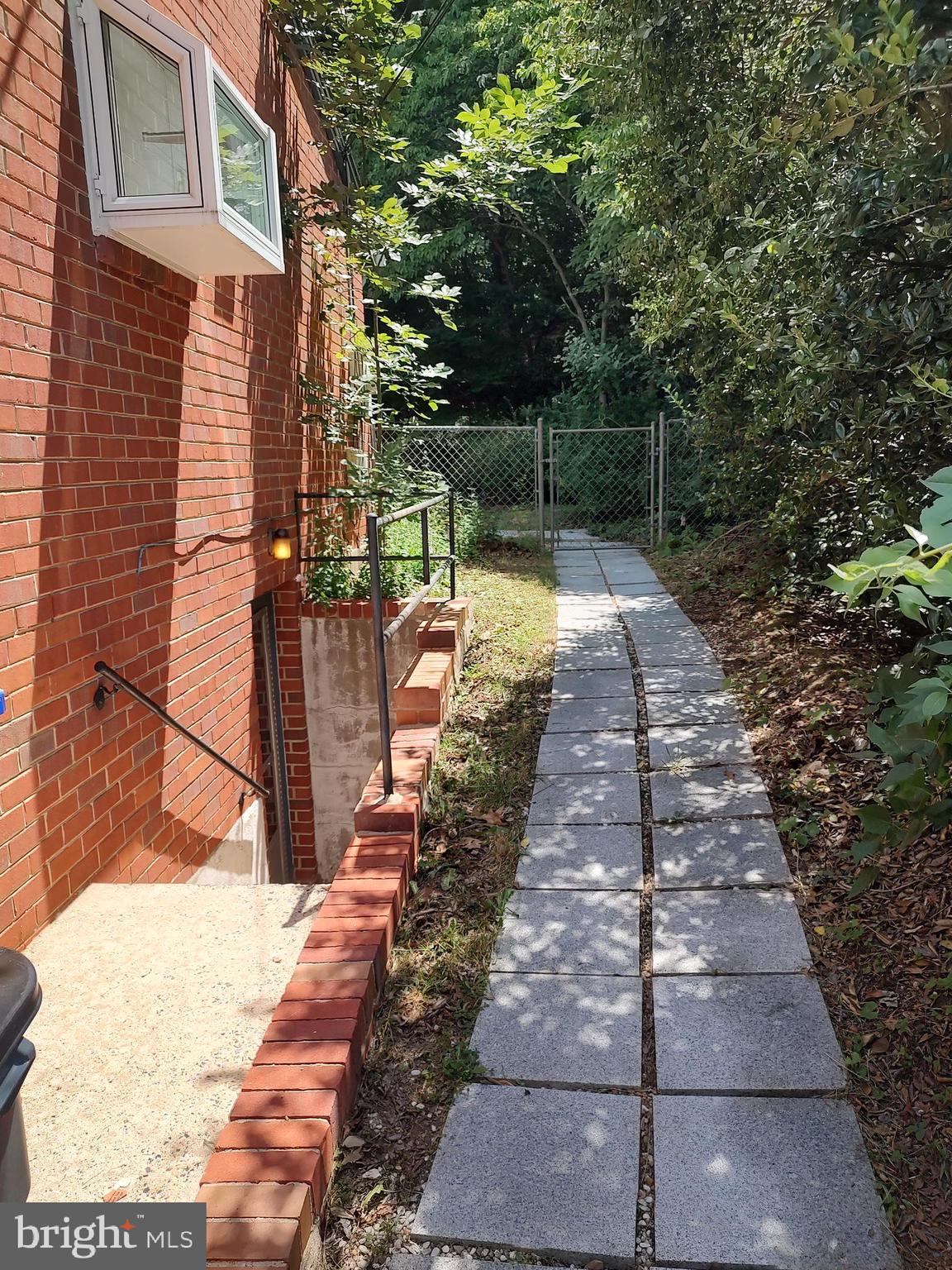 112 Claybrook Drive Silver Spring, MD 20902 - Photo 45 of 66 Path passing lower level entrance to back yard.