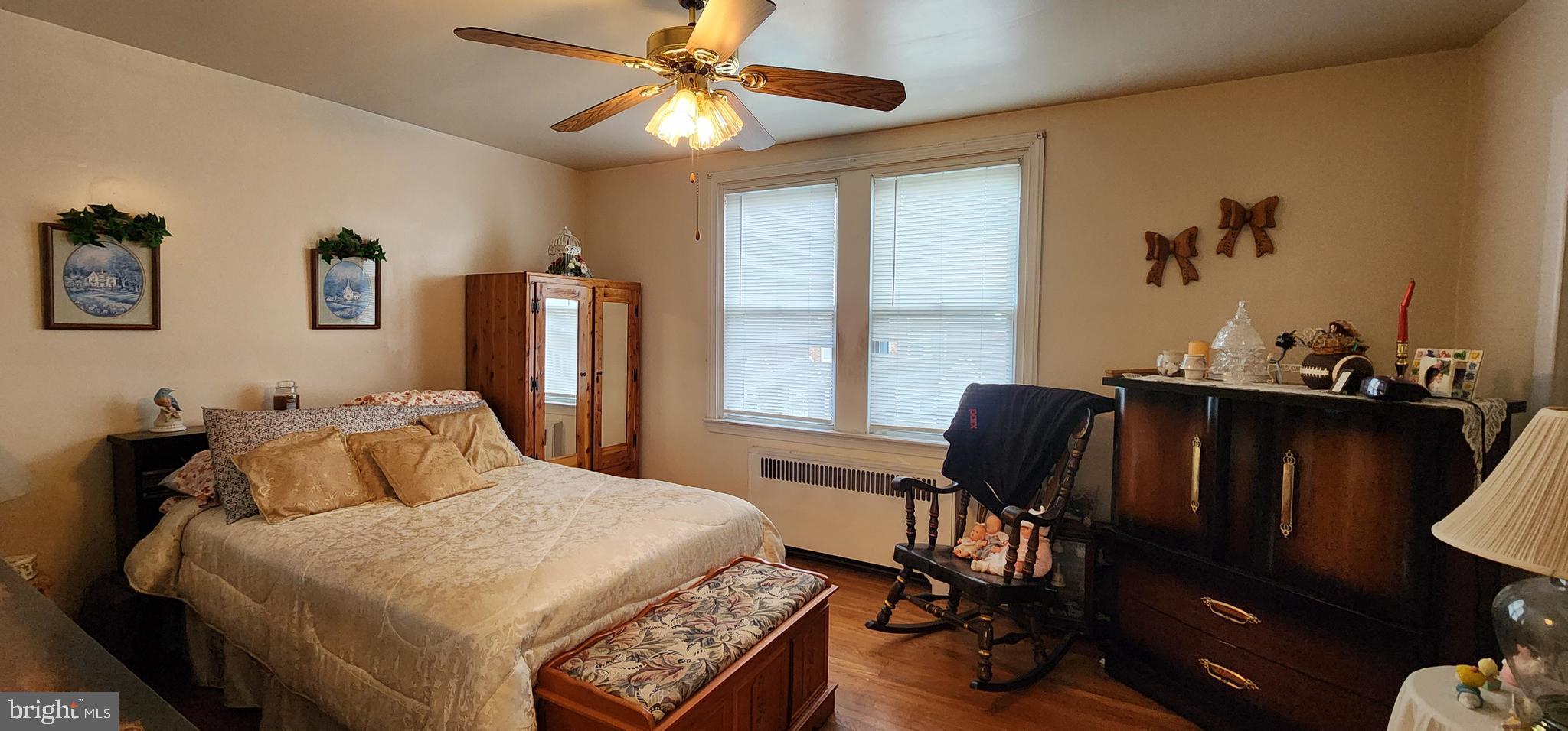 5624 Arbor Street Philadelphia, PA 19120 - Photo 11 of 17 a bedroom with a bed and a window