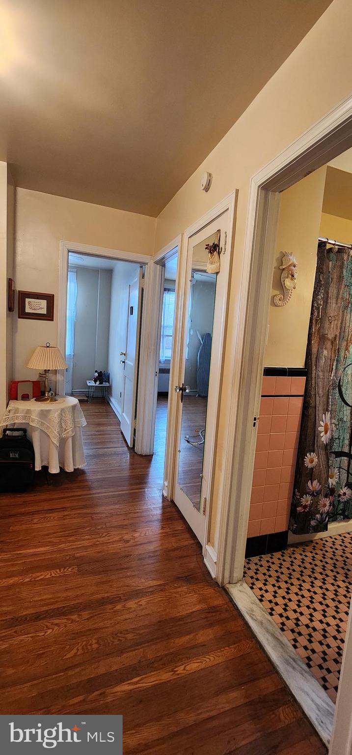 5624 Arbor Street Philadelphia, PA 19120 - Photo 14 of 17 a view of a bedroom with furniture and wooden floor