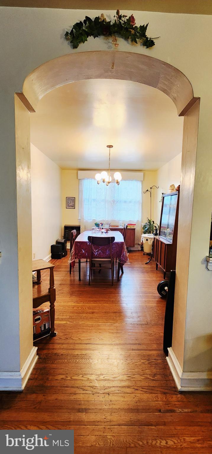 5624 Arbor Street Philadelphia, PA 19120 - Photo 4 of 17 a living room with furniture and a large mirror