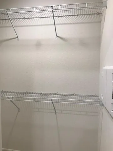 an empty room with mirror