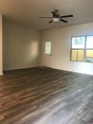 a kitchen with a refrigerator and a sink