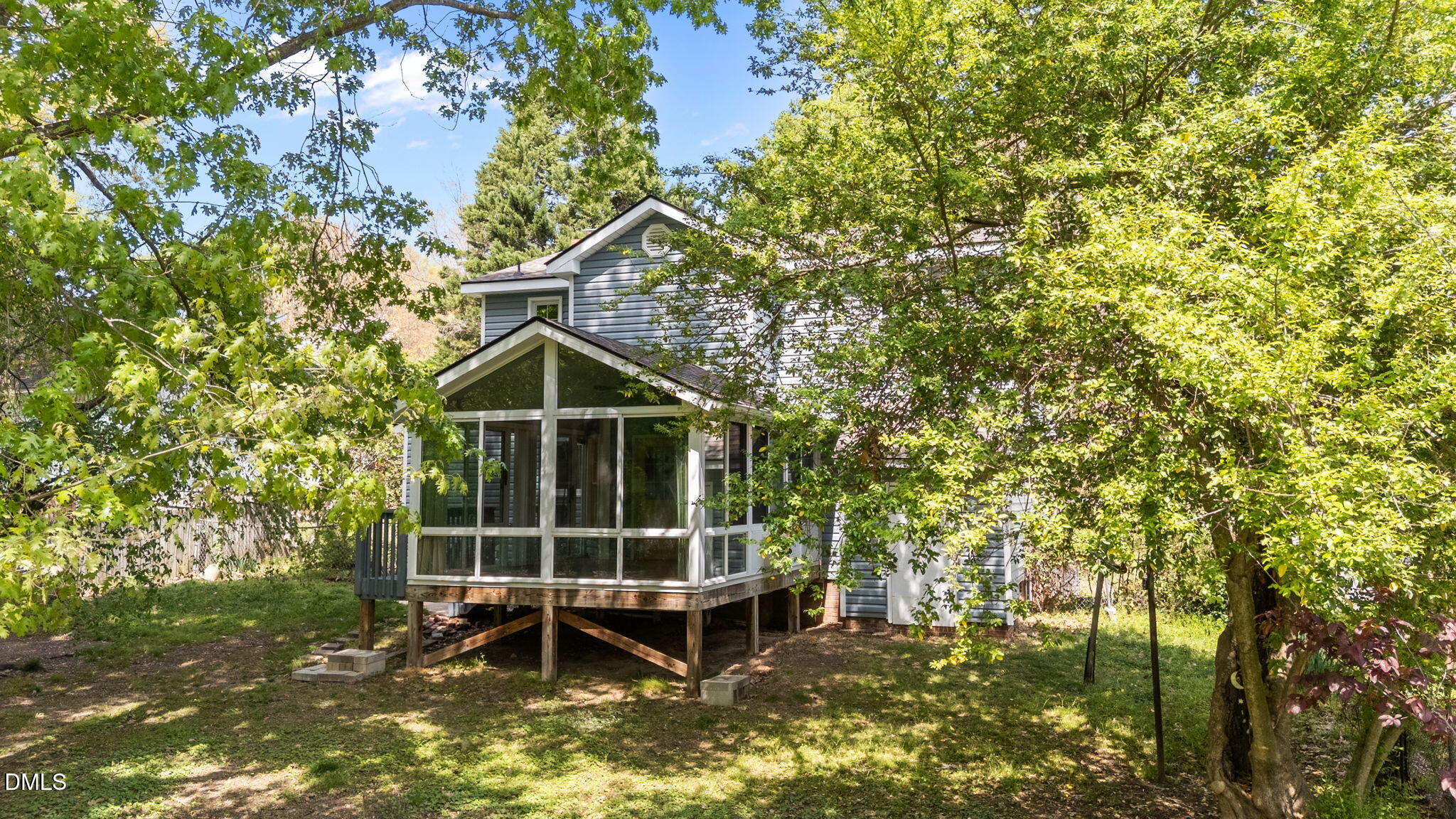 804 Olive Street Apex, NC 27502 - Photo 12 of 40 a view of a house with a yard and sitting area