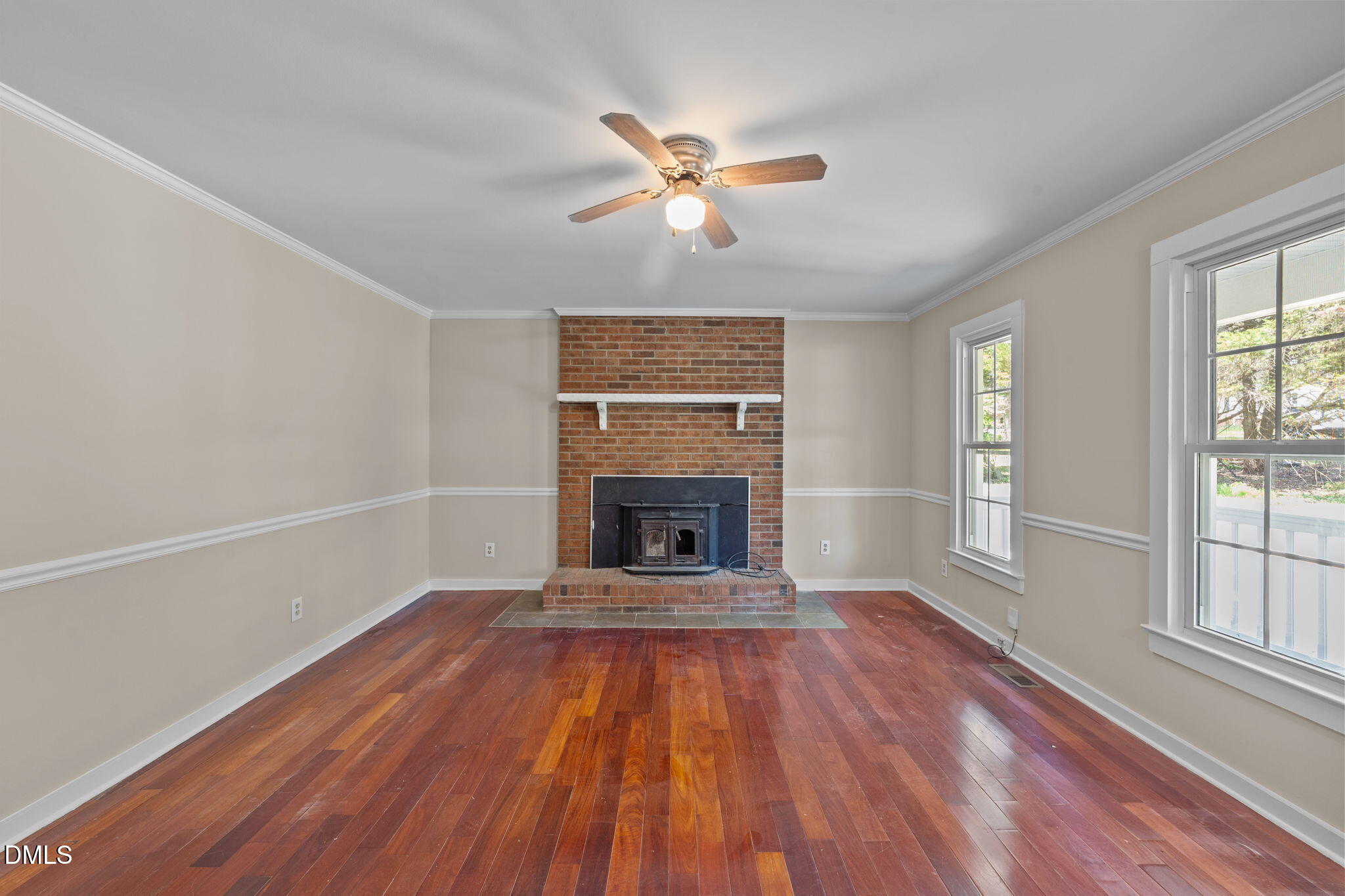 804 Olive Street Apex, NC 27502 - Photo 17 of 40 wooden floor in an empty room with a window