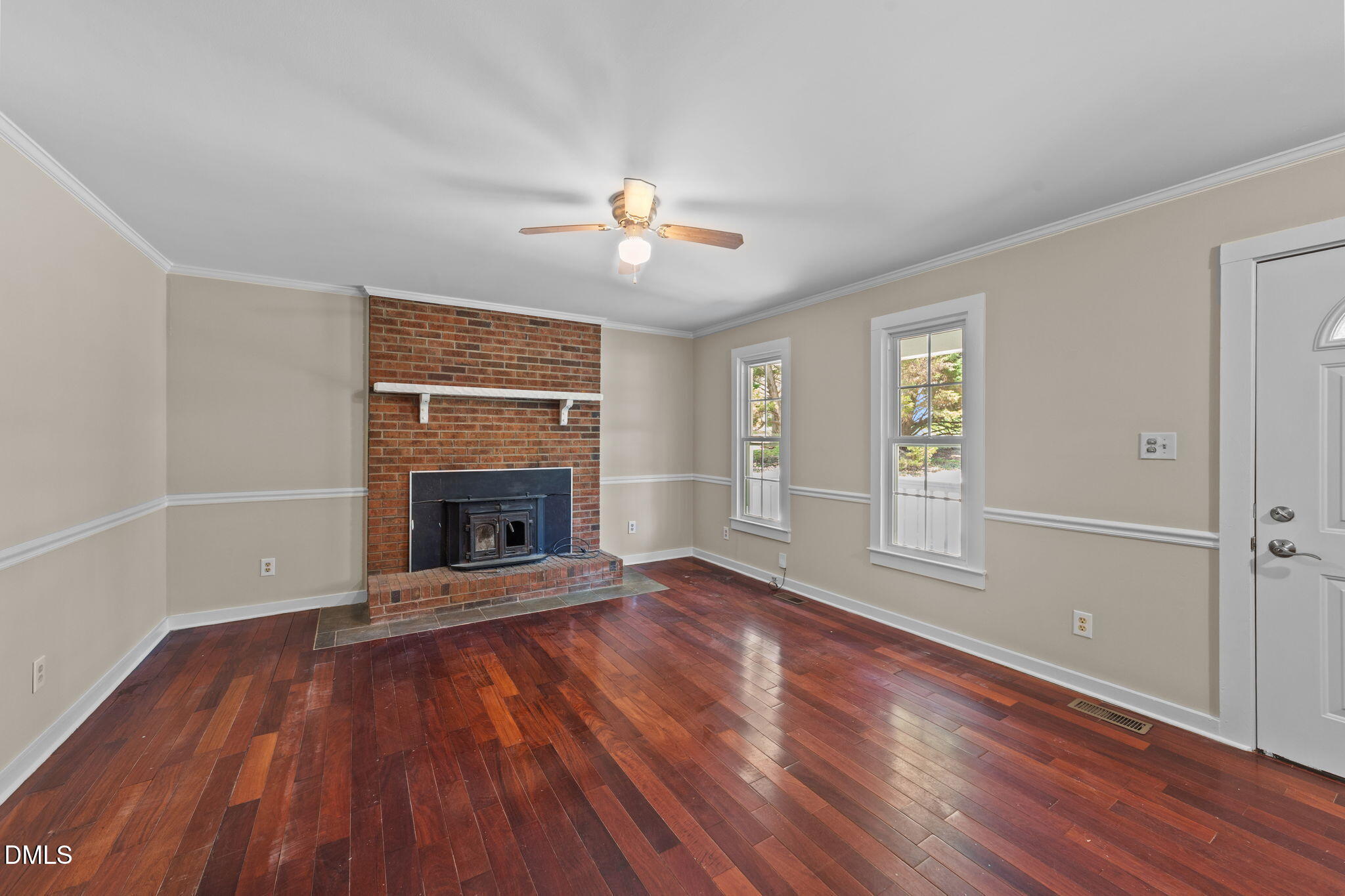 804 Olive Street Apex, NC 27502 - Photo 18 of 40 wooden floor fireplace and natural light in room