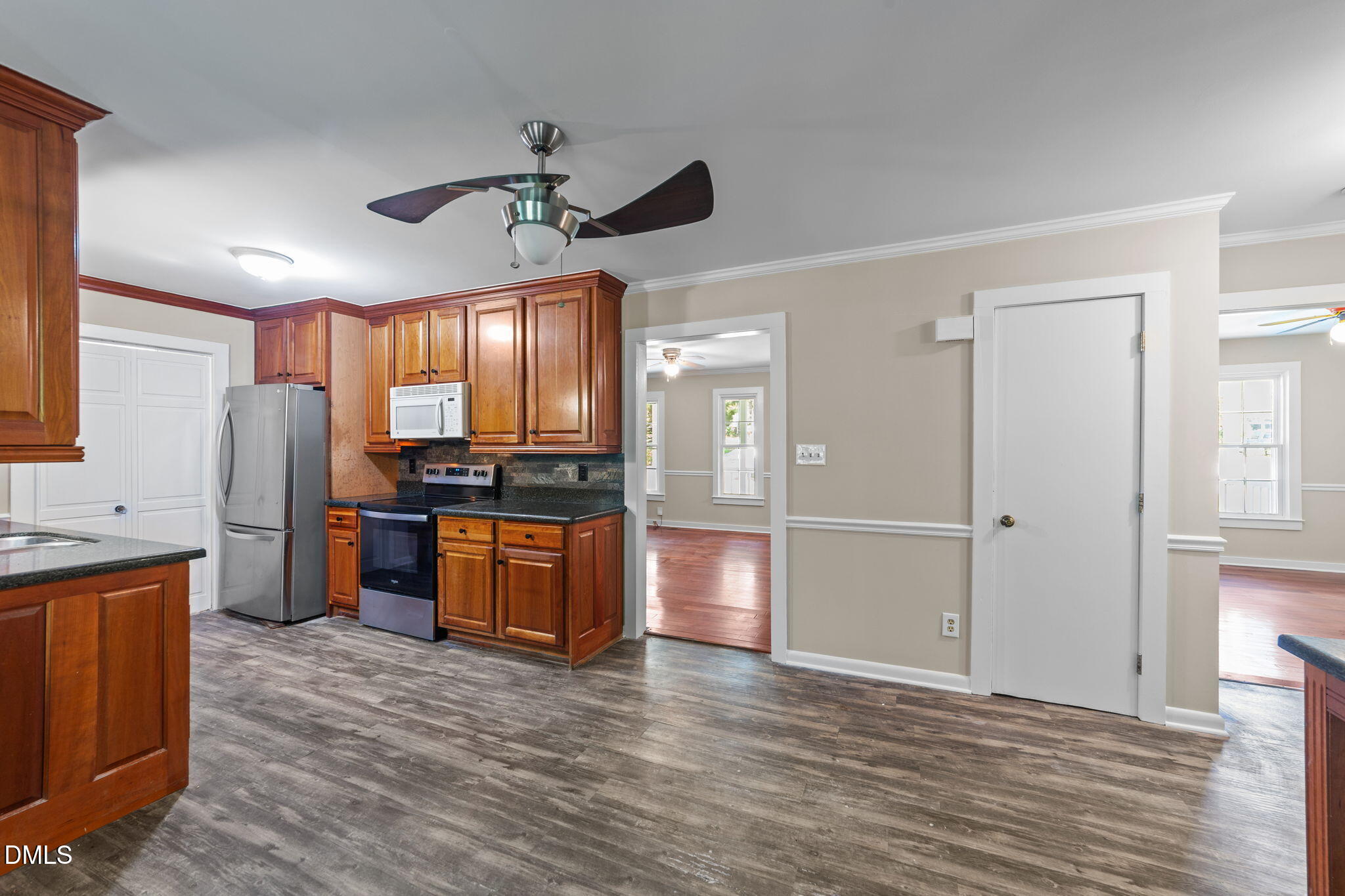 804 Olive Street Apex, NC 27502 - Photo 23 of 40 a kitchen with stainless steel appliances granite countertop a refrigerator and a stove top oven