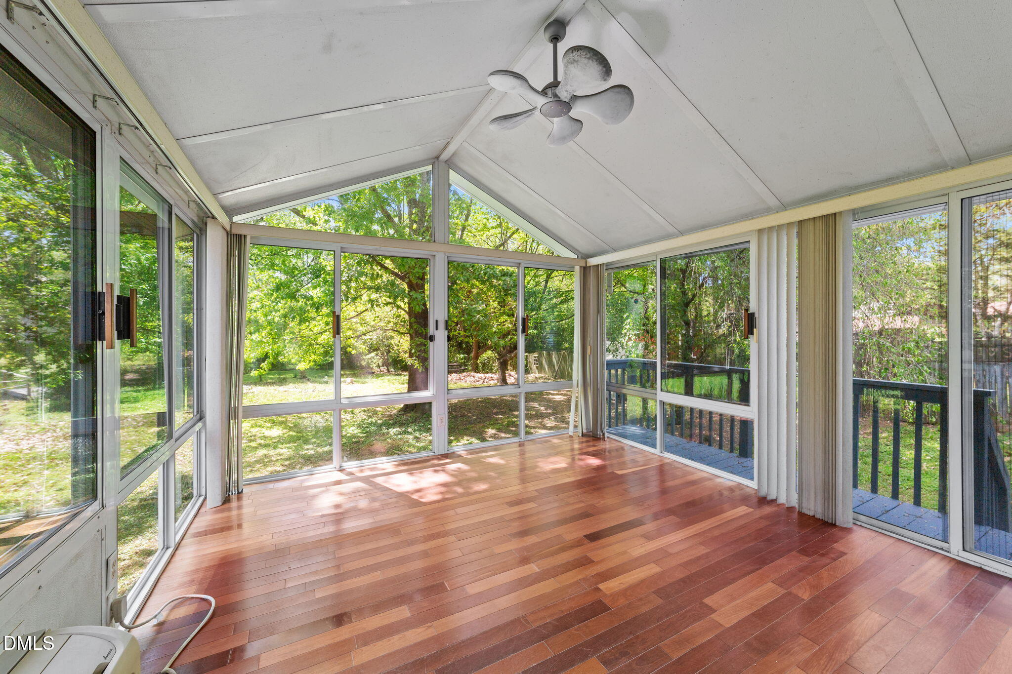 804 Olive Street Apex, NC 27502 - Photo 33 of 40 a view of empty room with wooden floor and outer view