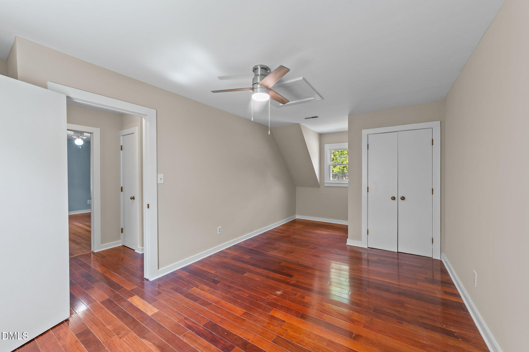 804 Olive Street Apex, NC 27502 - Photo 35 of 40 a view of empty room with wooden floor and ceiling fan