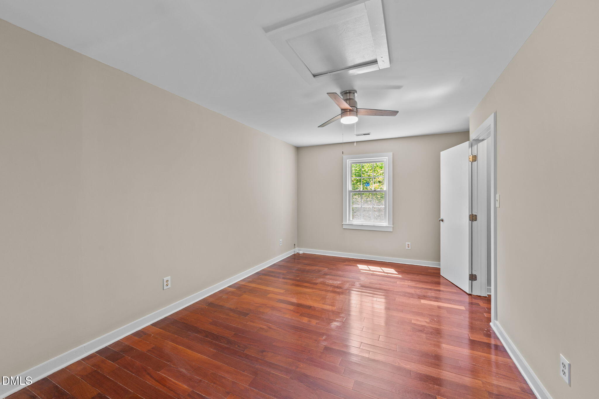 804 Olive Street Apex, NC 27502 - Photo 36 of 40 wooden floor in an empty room with a window