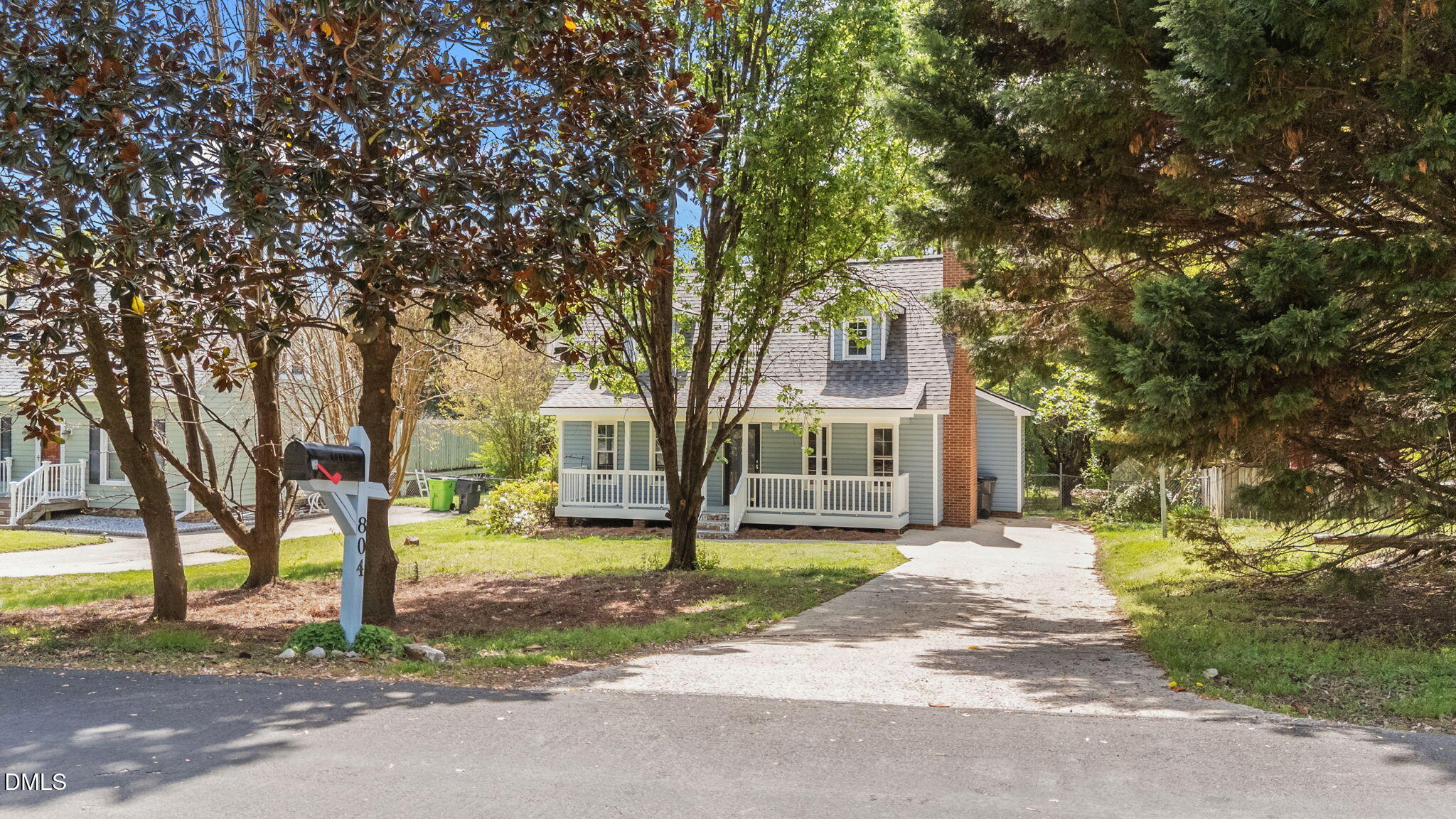 804 Olive Street Apex, NC 27502 - Photo 4 of 40 a front view of a house with a yard and trees