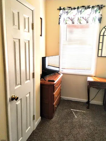 a room with a door and a window