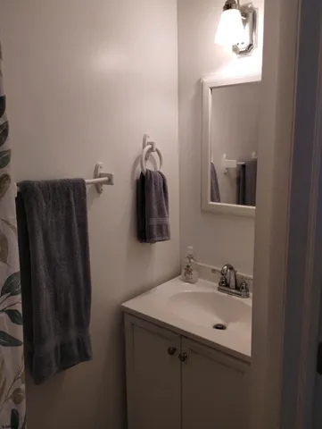 a bathroom with a sink and mirror