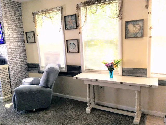 a living room with furniture and window