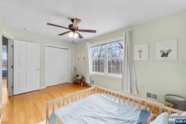 a bedroom with a bed furniture and a window