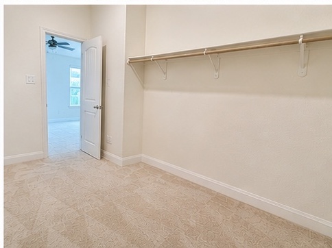 2101 Split Diamond Way, Unit 40 Round Rock, TX 78664 - Photo 22 of 32 Ample storage solutions await in this well-appointed walk-in closet.