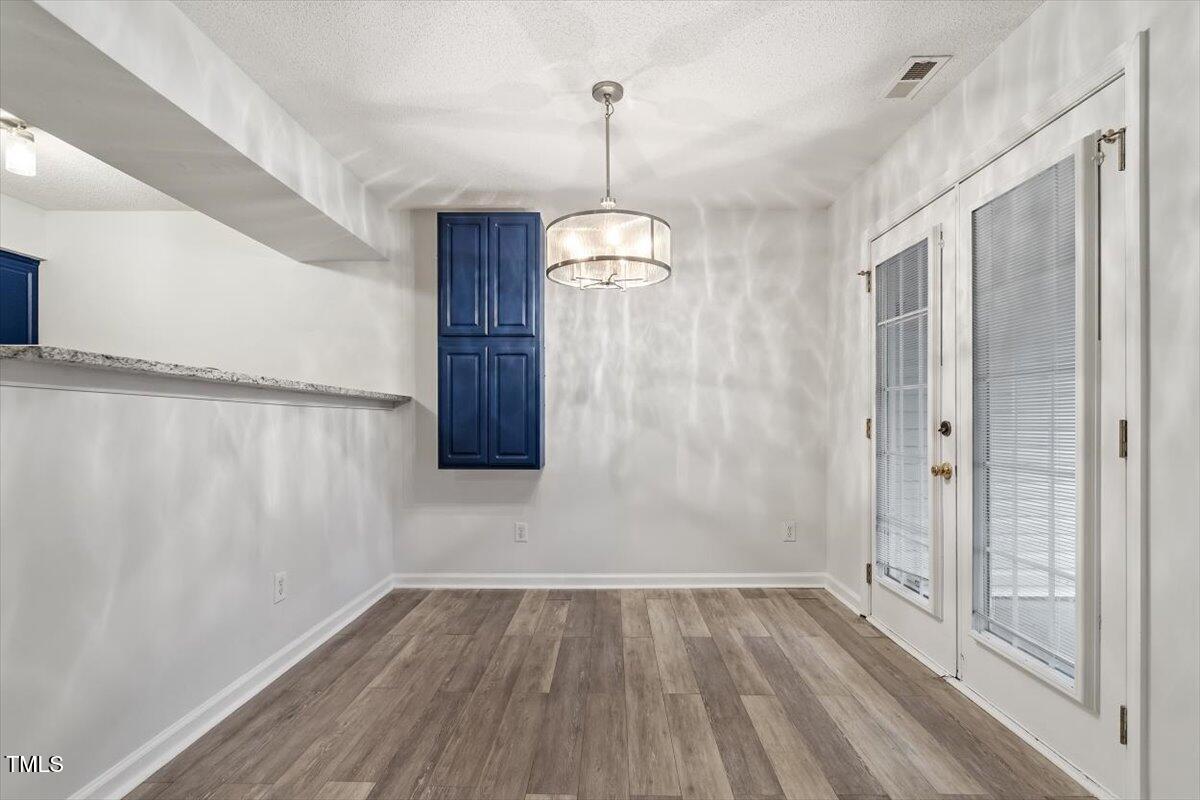 3307 Tarleton West, Unit A4 Durham, NC 27713 - Photo 21 of 40 a view of a room with wooden floor and windows