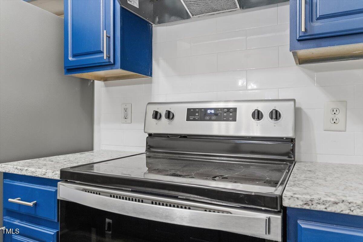 3307 Tarleton West, Unit A4 Durham, NC 27713 - Photo 29 of 40 a stove top oven sitting inside of a kitchen