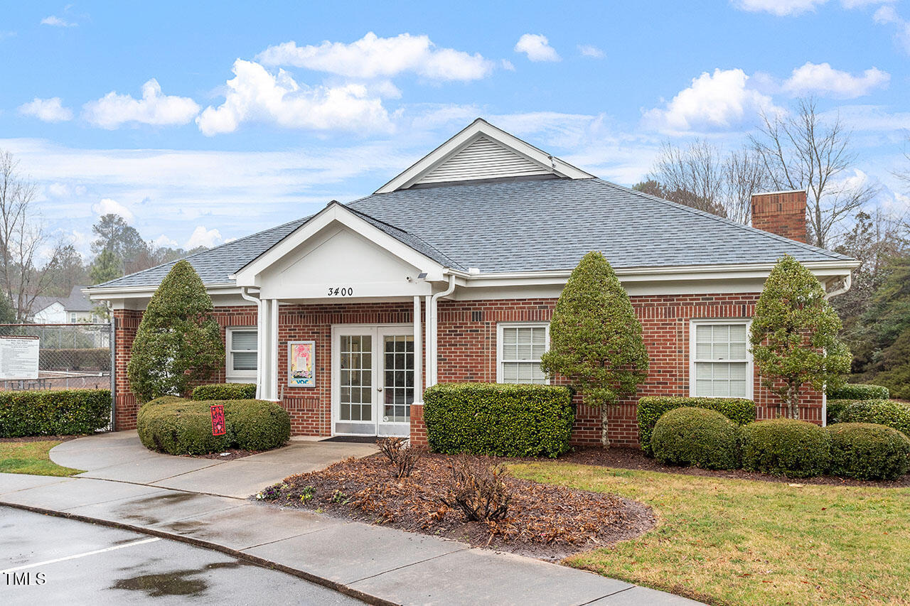 3307 Tarleton West, Unit A4 Durham, NC 27713 - Photo 37 of 40 a view of a house with a yard and large tree