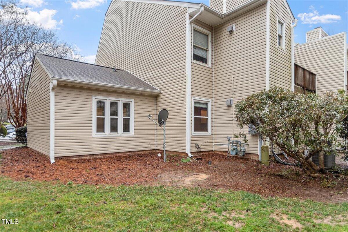 3307 Tarleton West, Unit A4 Durham, NC 27713 - Photo 8 of 40 a backyard of a house with potted plants and large tree