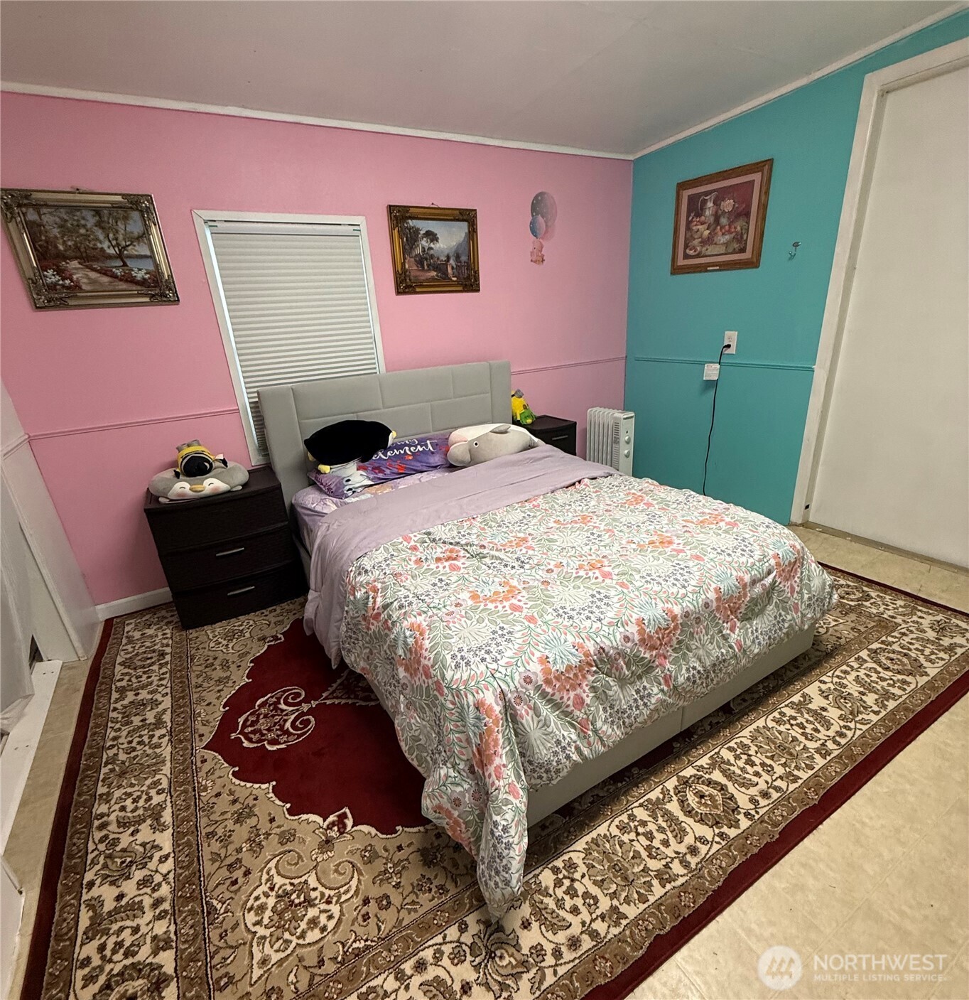 1919 Riddell Street Raymond, WA 98577 - Photo 12 of 25 a bedroom with a bed and painting on the wall