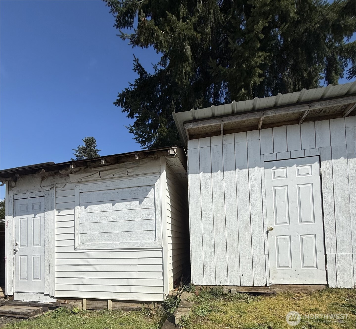 1919 Riddell Street Raymond, WA 98577 - Photo 17 of 25 a view of a house with a wooden fence
