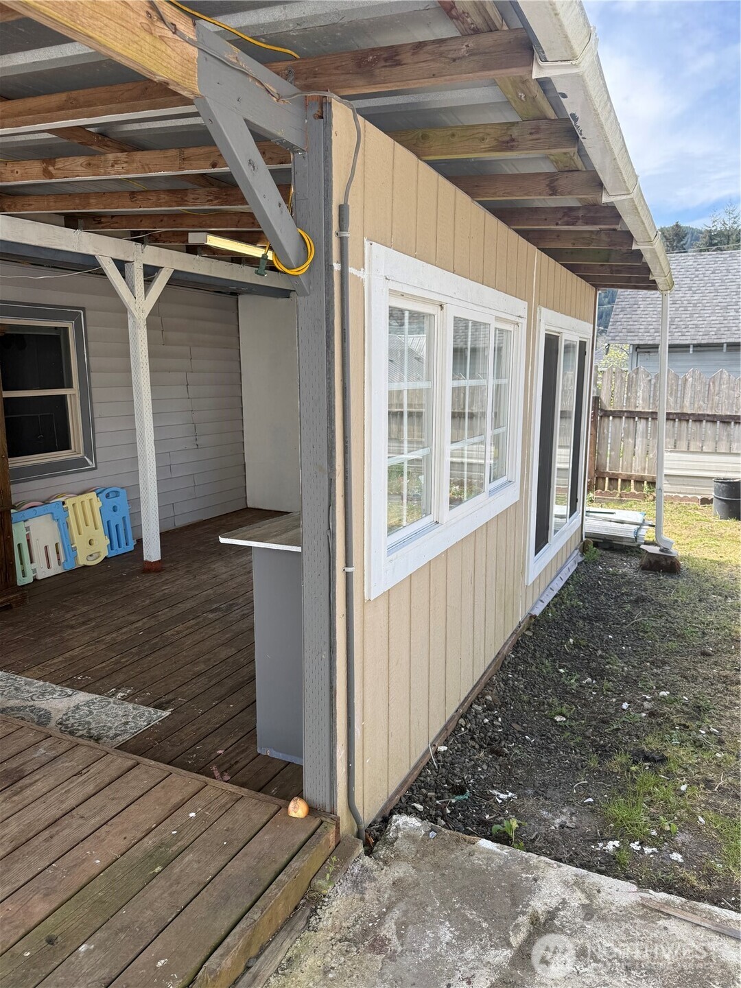 1919 Riddell Street Raymond, WA 98577 - Photo 23 of 25 a view of a house with a wooden deck