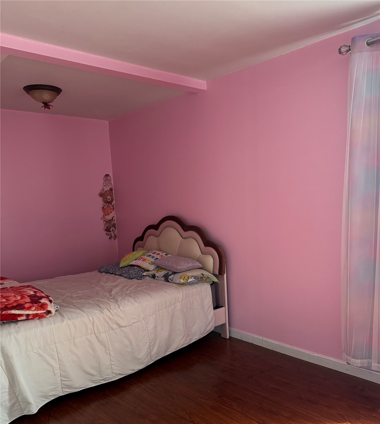 1919 Riddell Street Raymond, WA 98577 - Photo 10 of 25 a bedroom with a bed and a wooden floor