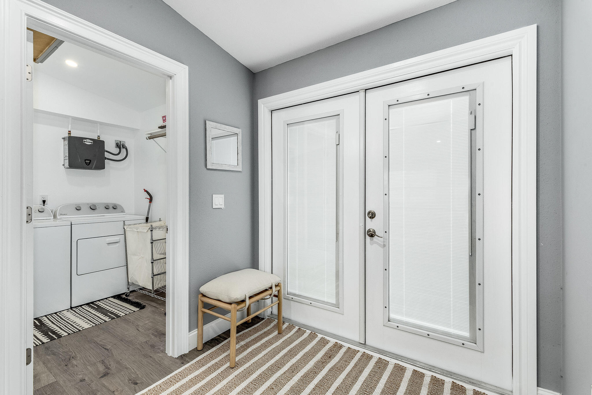 411 4th Street Merritt Island, FL 32953 - Photo 11 of 26 a en suite bathroom with a sink a toilet and a mirror